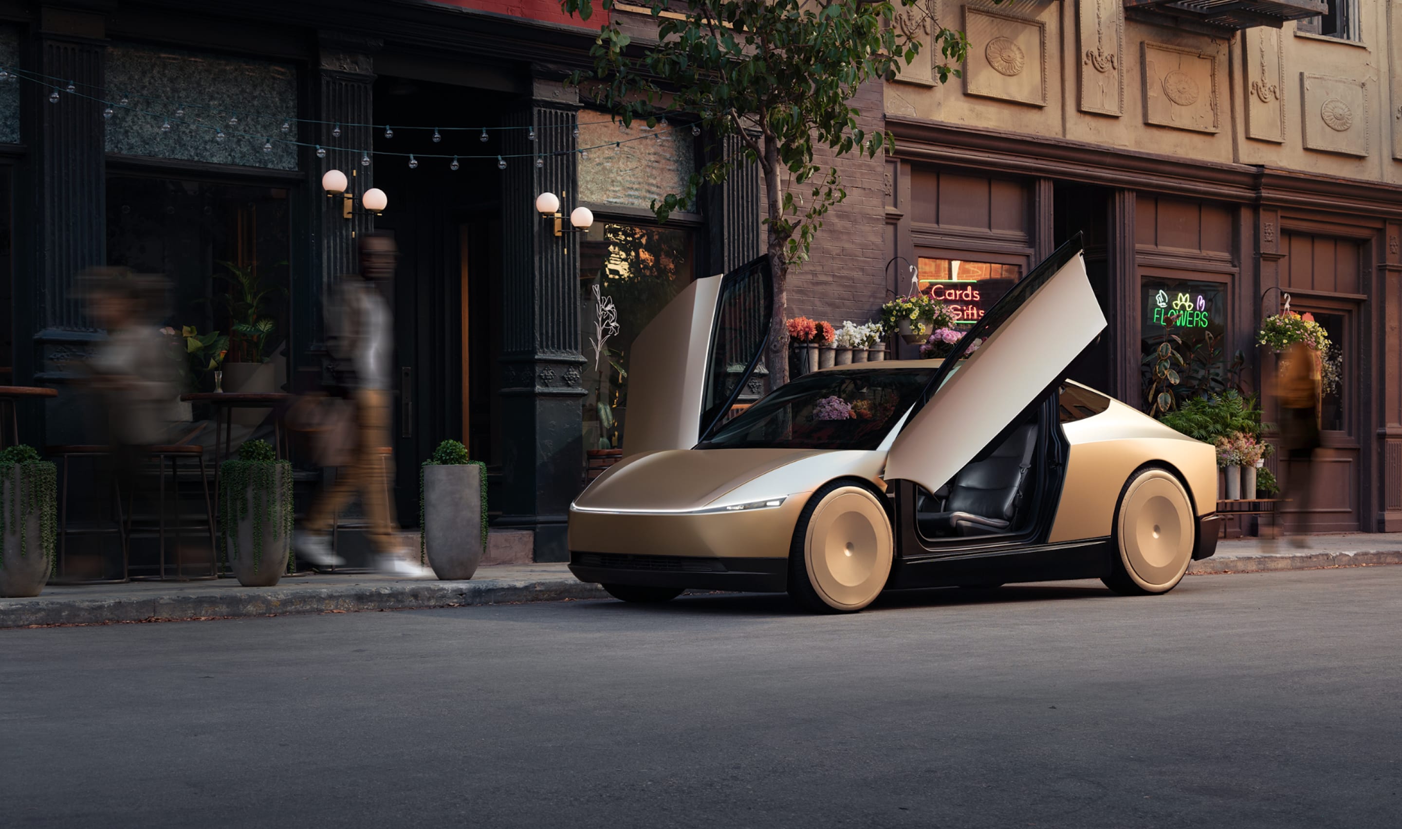 Vista aérea de un robotaxi de Tesla exhibido en un evento, mostrando su diseño futurista con puertas tipo ala de gaviota abiertas. El vehículo, de color dorado, está rodeado por asistentes que lo observan desde una distancia delimitada por vallas. La escena tiene iluminación cálida, y en la esquina inferior derecha se puede ver el logotipo de Tesla.