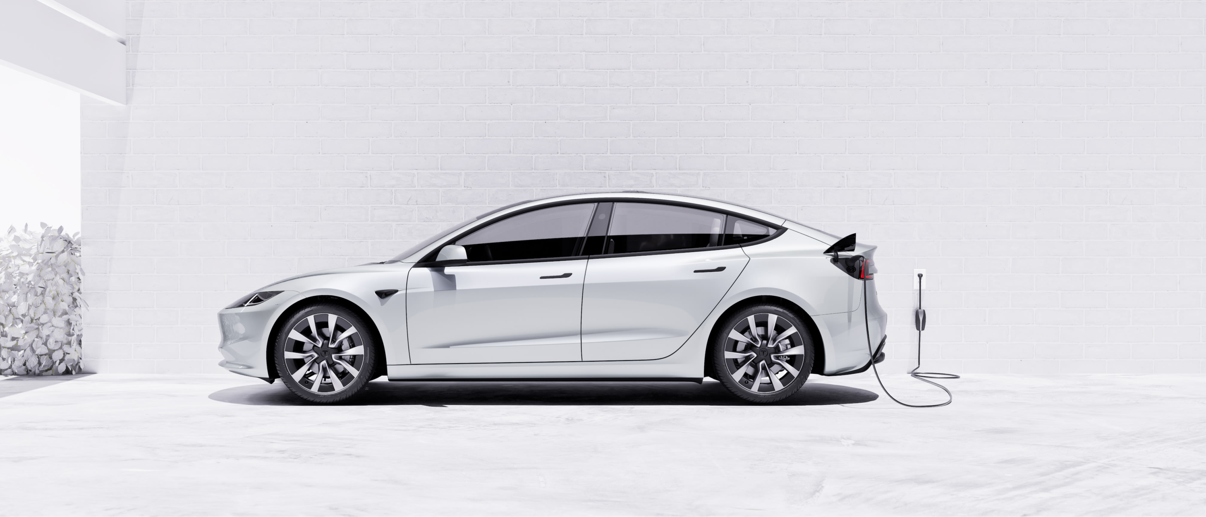 טעינת Model 3 בצבע לבן עם מחבר נייד.