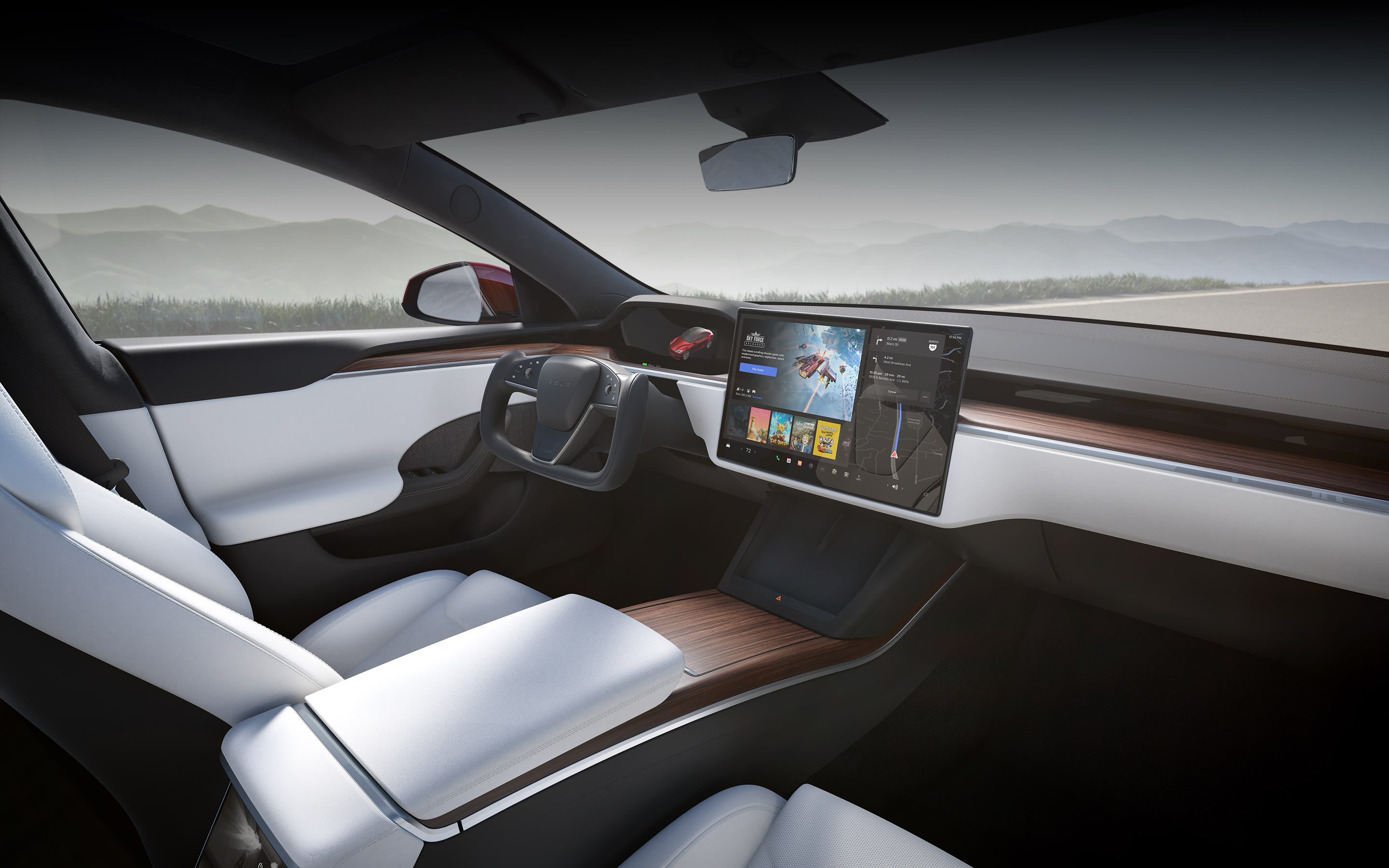 Model S mit weißem Innenraum und Blick auf den Infotainment-Touchscreen vom Beifahrersitz aus