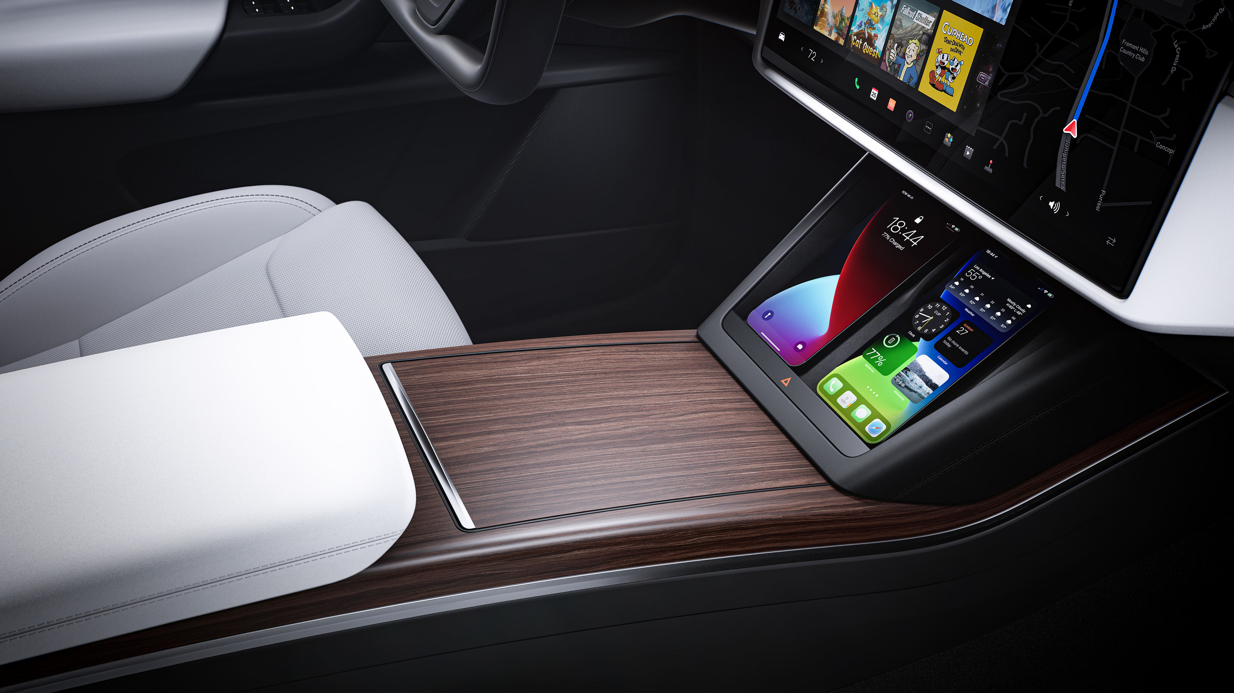 Imagen del interior desde el punto de vista del asiento del pasajero de la consola con dos smartphones cargándose de forma inalámbrica