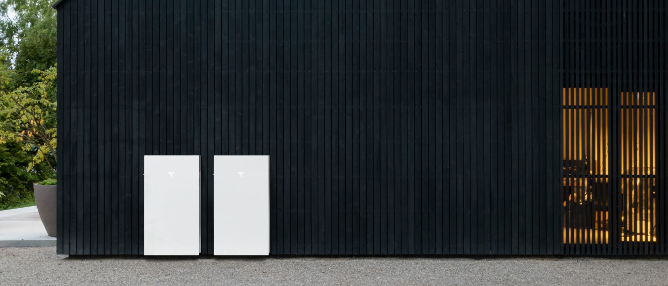 Two Powerwall 3s installed outside of a home