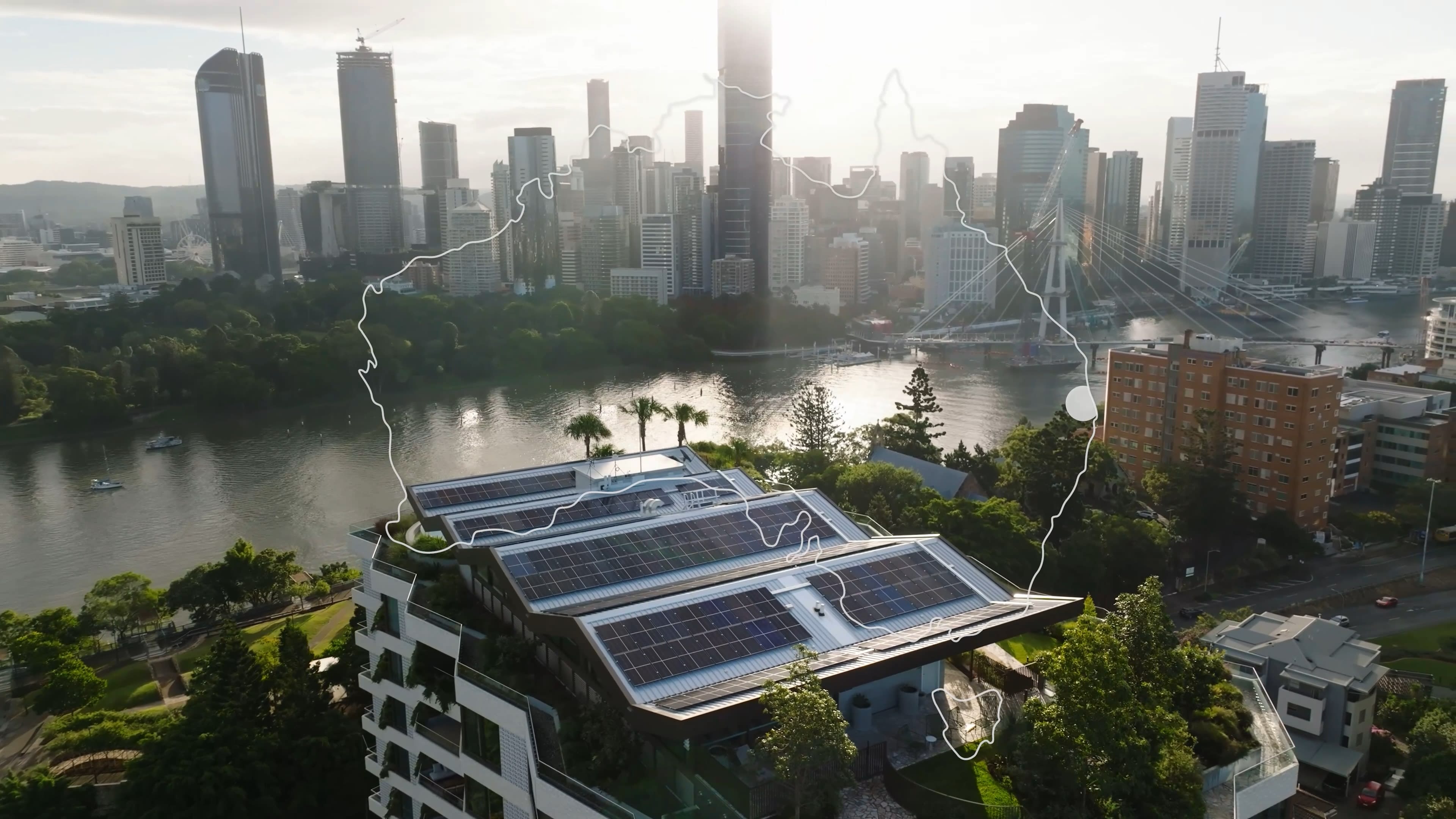 Aerial shot of apartments with solar panels and Australia outlined