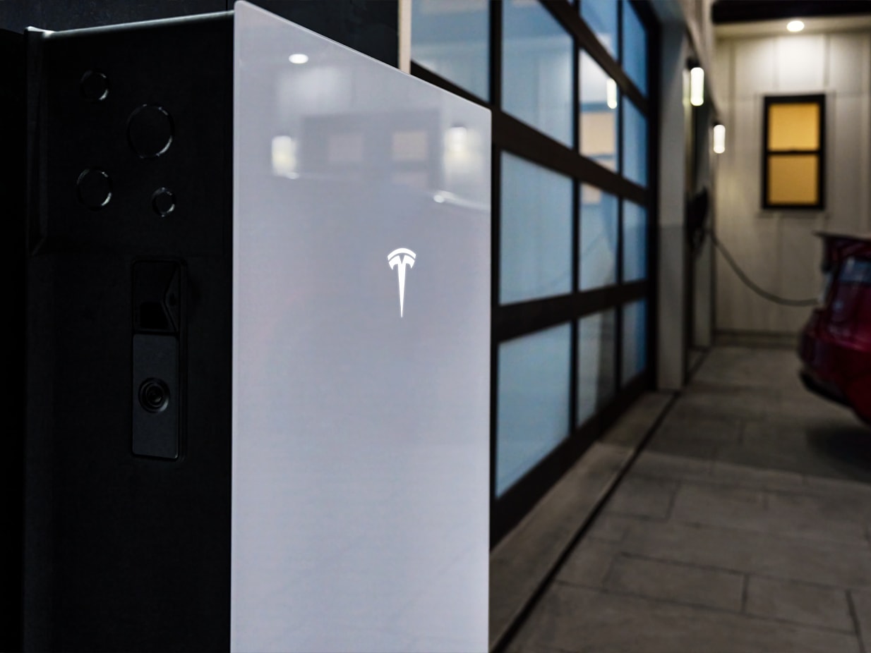 Close up view of Powerwall 3 installed outside a home