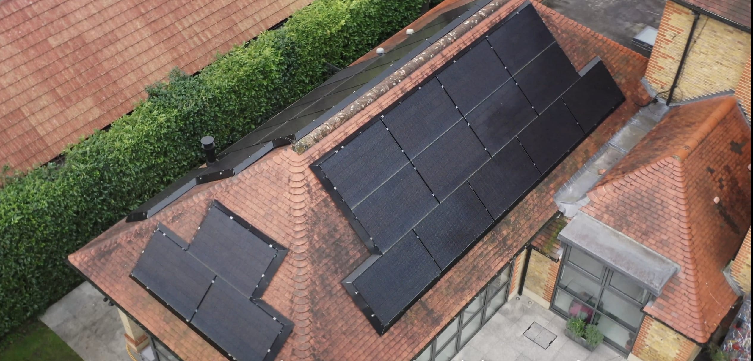 House with solar panels and powerwalls