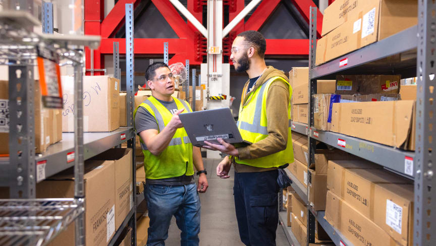 Supply chain employees working in factory