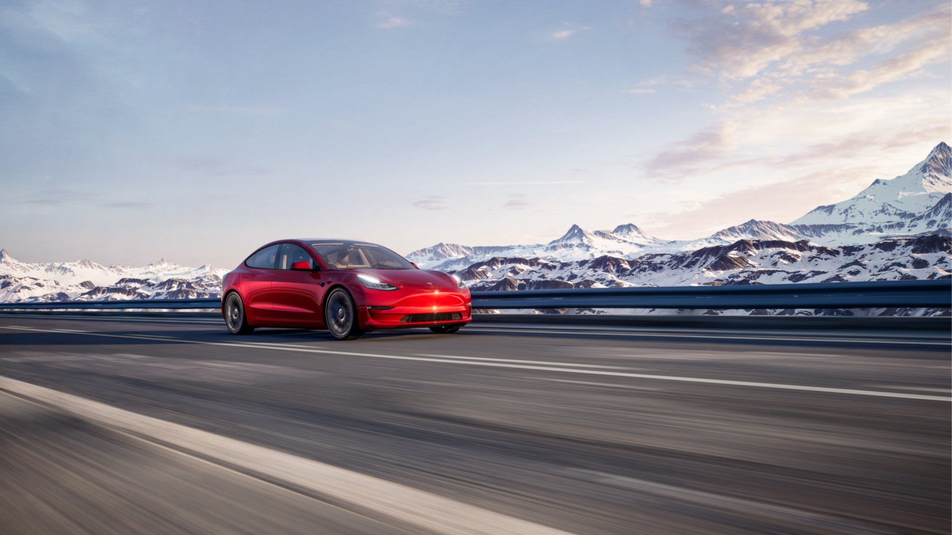 Red Tesla Model 3 Performance with mountain backdrop