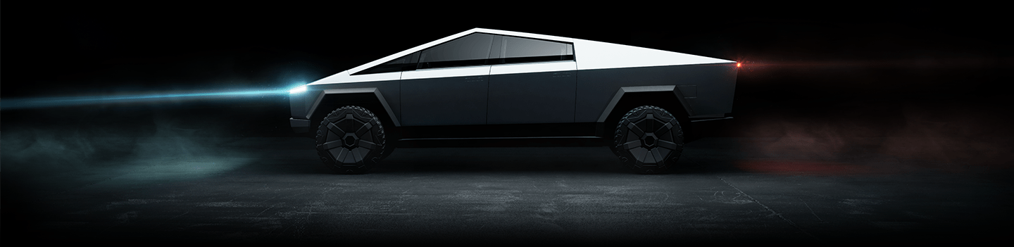 Cybertruck with headlight glowing in the dark