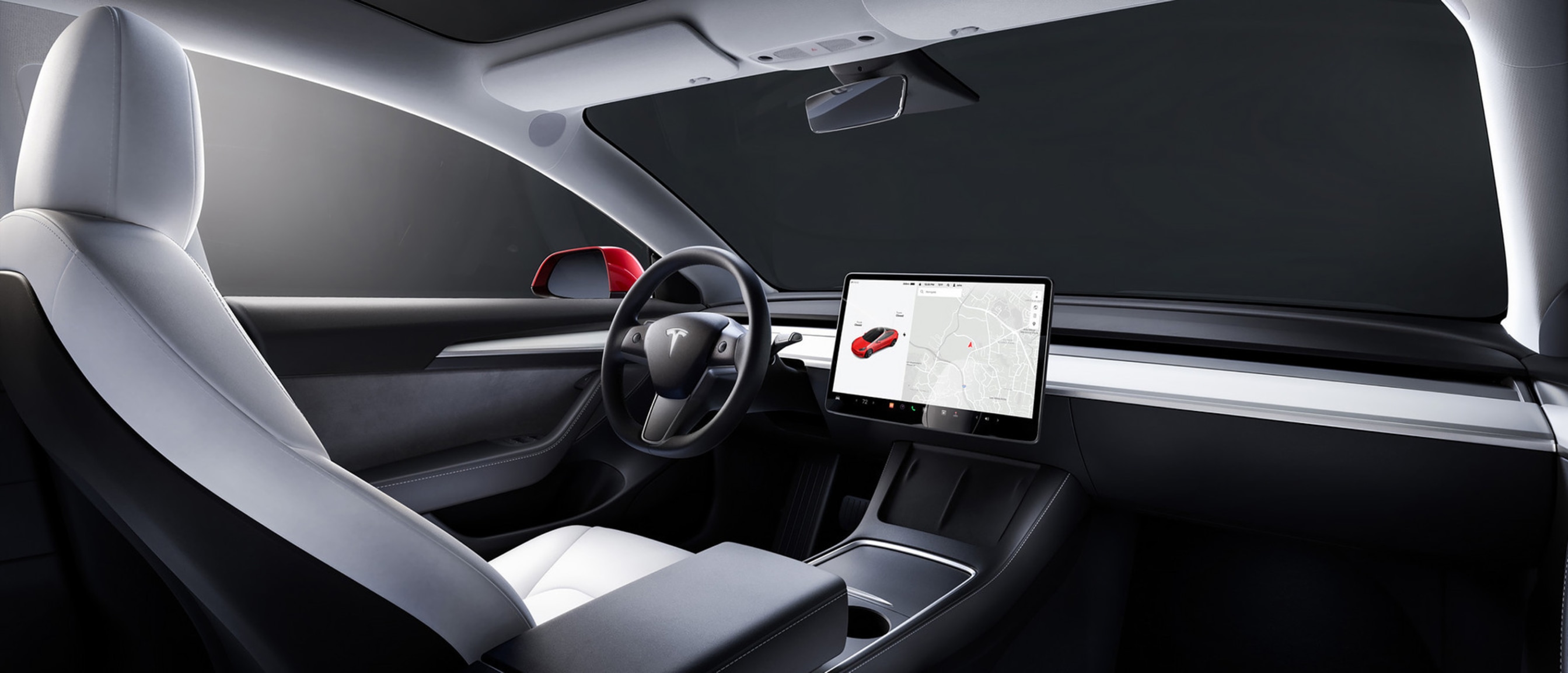 Backseat view from inside a Model 3 with white interior