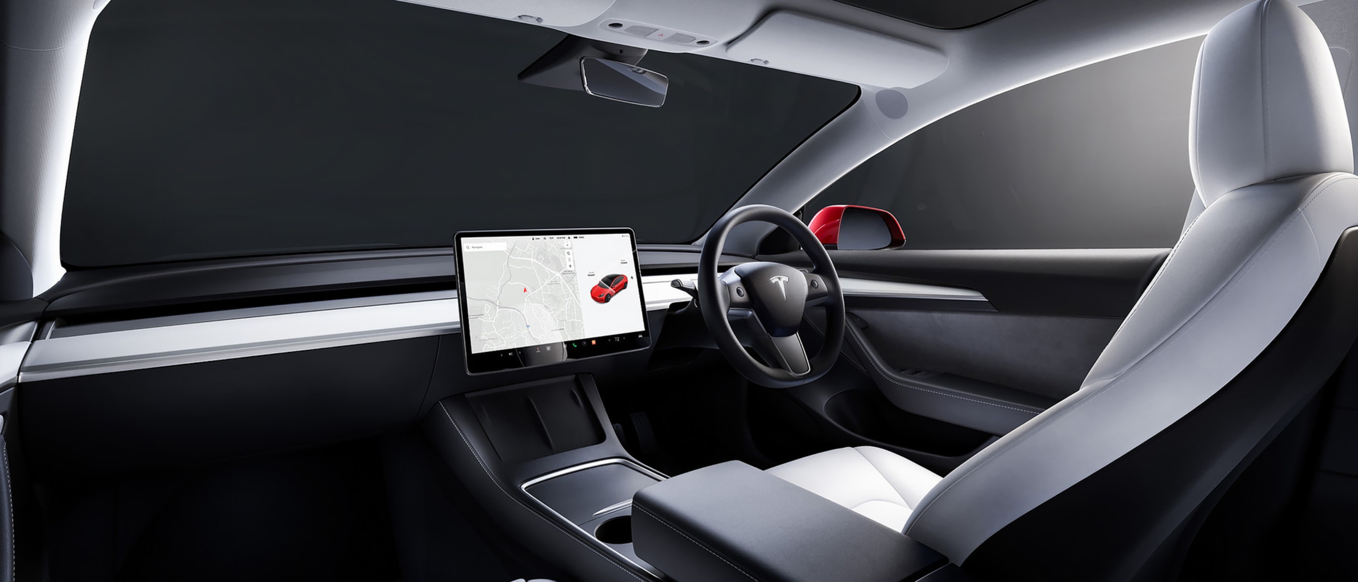 Backseat view from inside a Model 3 with white interior