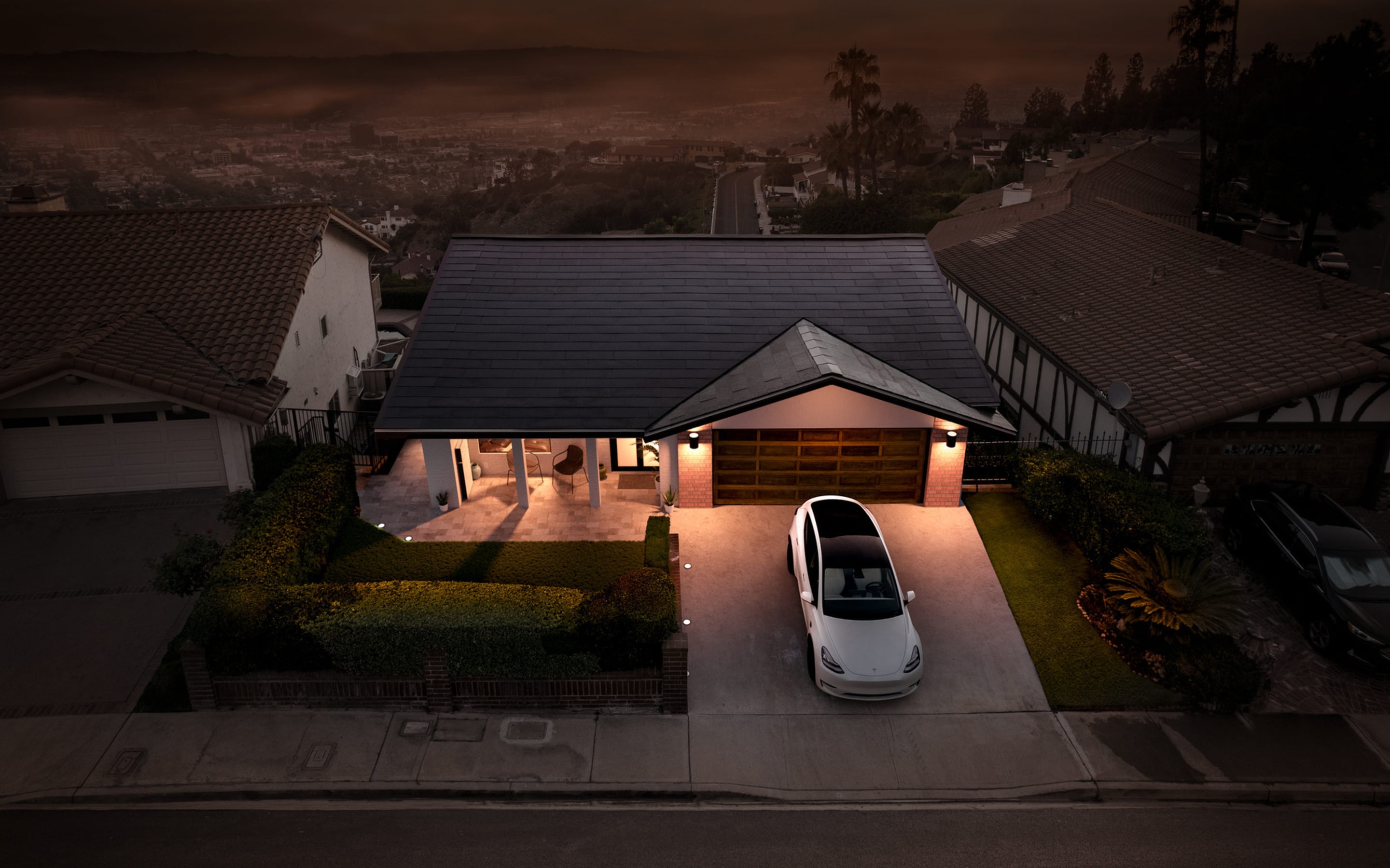 Solar Roof on single story home with white Model 3 in driveway
