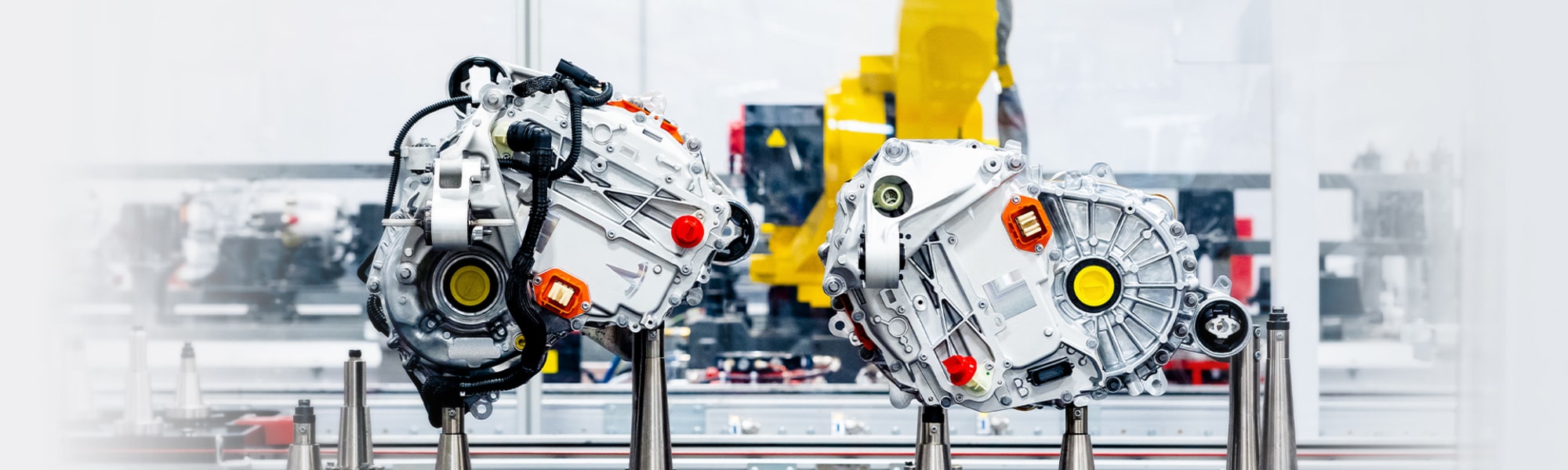 Image of two Tesla powertrains inside a factory