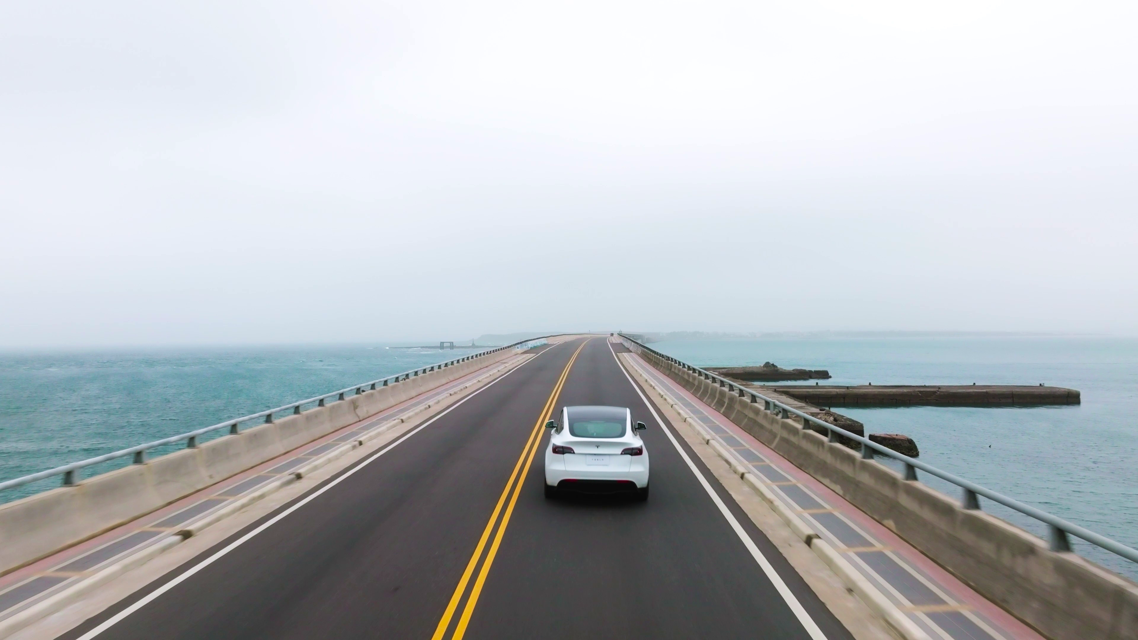 white Model Y on the road